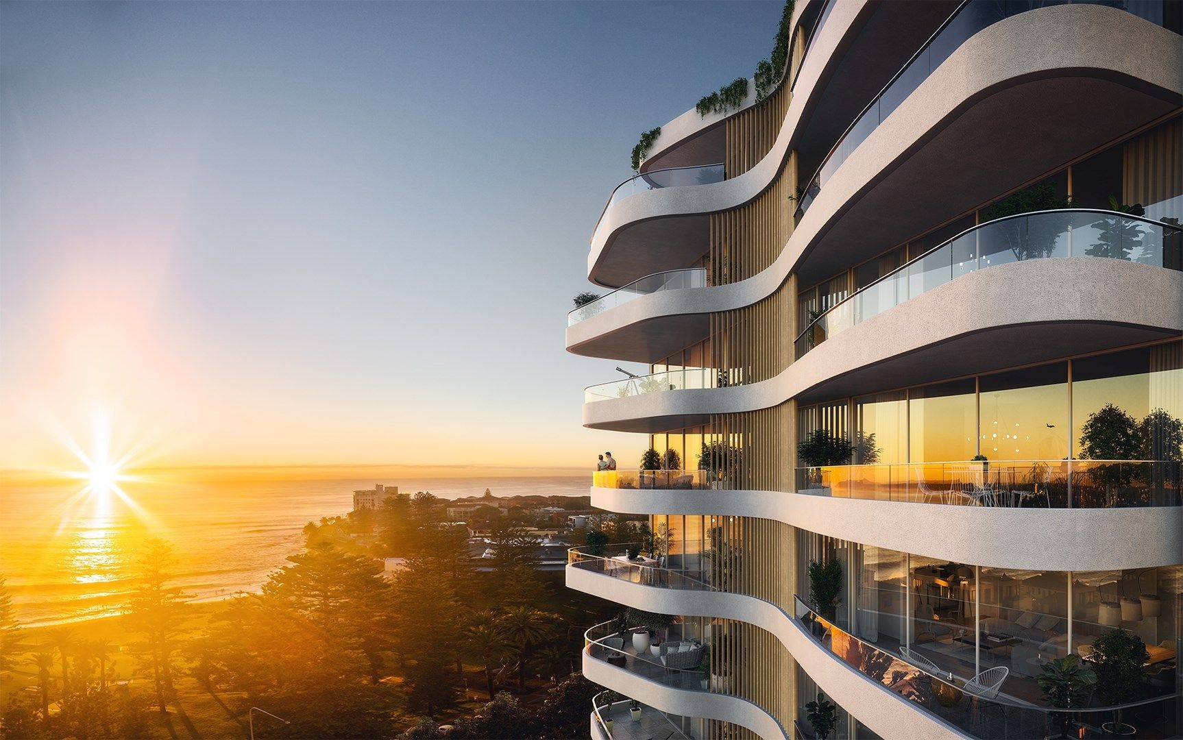Coastal residential development above the ocean at sunset